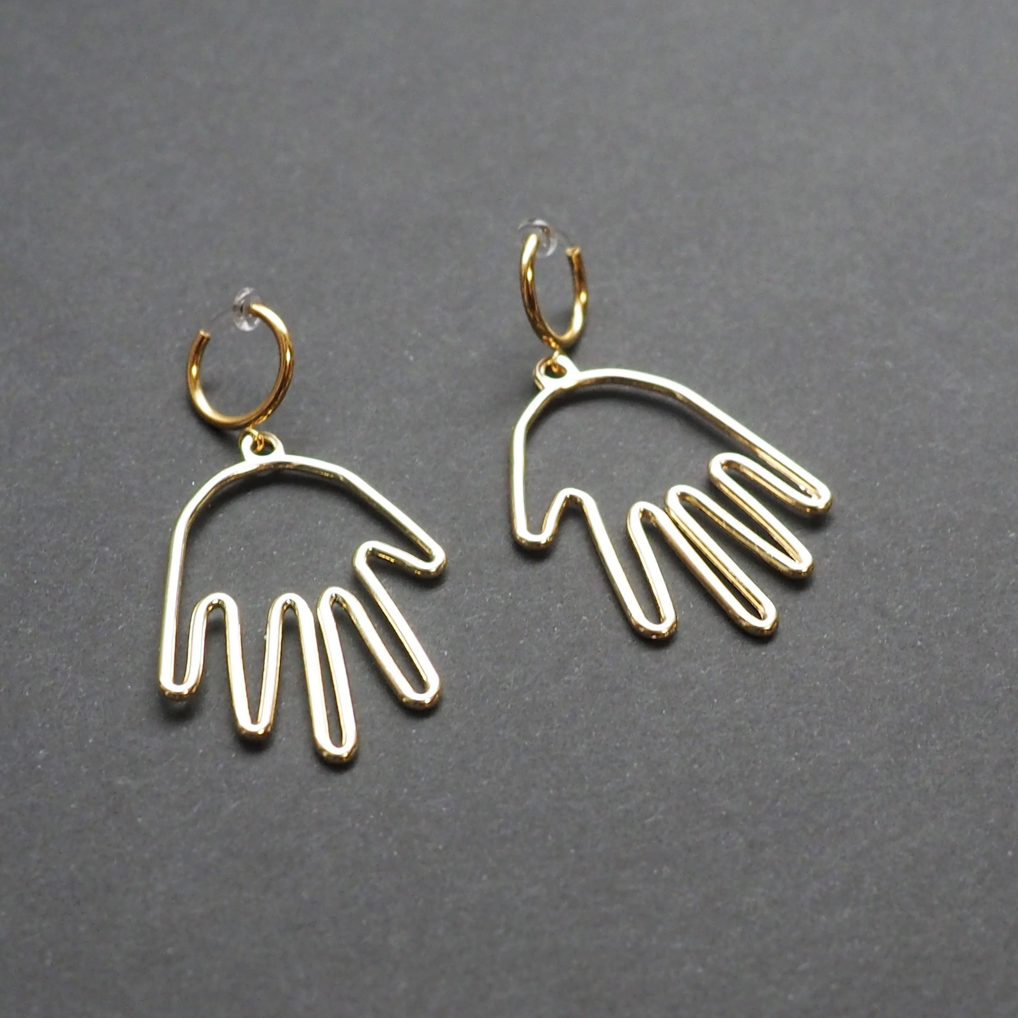 Gold hands clip on hoop earrings