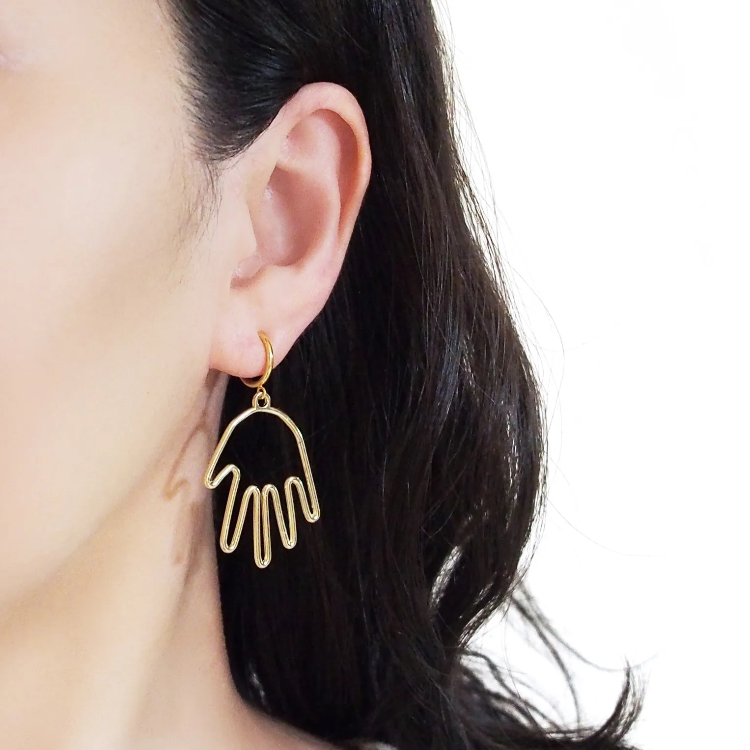 Gold hands clip on hoop earrings