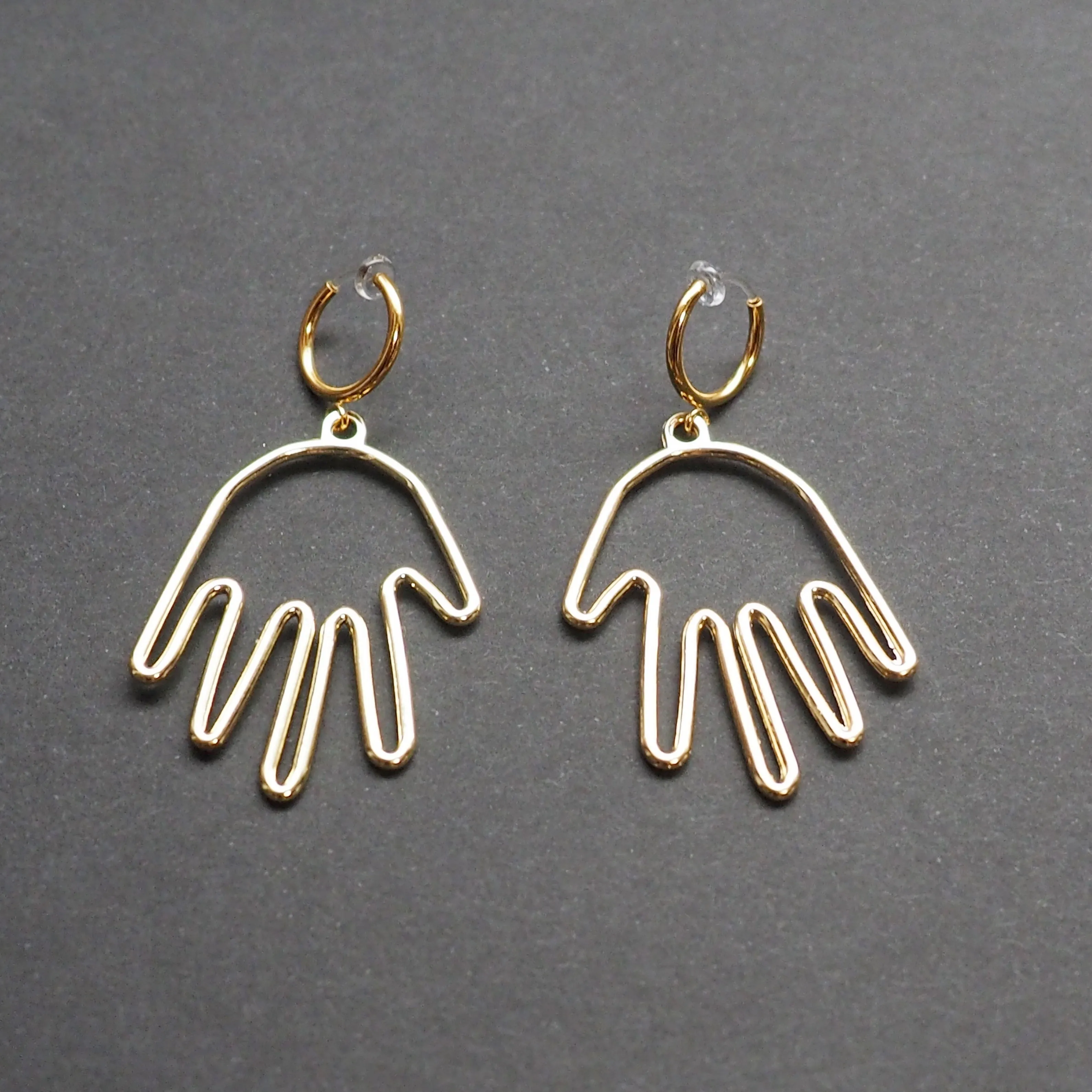 Gold hands clip on hoop earrings